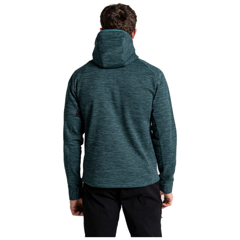 A person is standing with their back facing the viewer wearing a dark teal hoodie. The scene is neutral with no specific background details visible.