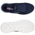 Navy blue athletic shoes are displayed from above showing a mesh upper with laces and a white sole featuring a textured design suitable for walking and casual wear.