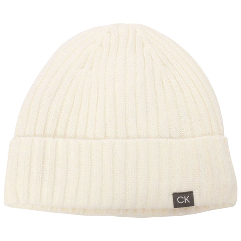 A white ribbed knit beanie rests flat showcasing its foldable cuff and a small CK label on the side designed for warmth and style in cold weather environments.