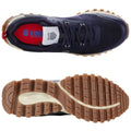 Navy blue athletic shoes display a textured rubber sole providing grip and stability resting on a plain white background showcasing their design and structure with a focus on functionality.