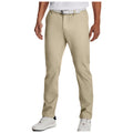 Tan golf chinos are being worn by a man standing upright in a relaxed stance. He pairs them with a white shirt and white shoes with black accents in a neutral indoor setting, highlighting their versatile style.