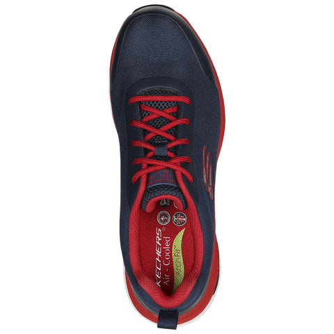 A navy sneaker with red accents features laces and a cushioned interior labeled "KEECHERS Air Cooled" resting on a flat surface, designed for comfort and support during wear.