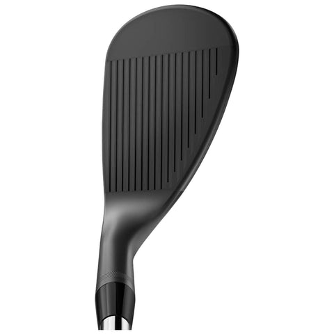 A black golf club head is positioned upright showcasing its grooved face designed for better ball control in play on a golf course environment.