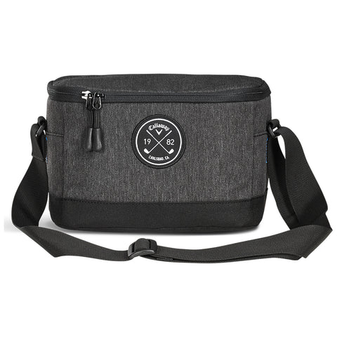 A black and grey fabric bag with a circular logo sits flat with a zipper at the top and an adjustable shoulder strap beside it on a white background.