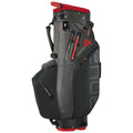 A golf bag stands upright featuring a sleek black and red design it has waterproof materials and multiple pockets for storage ready for use on the golf course