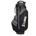 A black golf bag stands upright featuring a logo and multiple zippered pockets for storage with reflective detailing and a comfortable handle for carrying on the golf course.