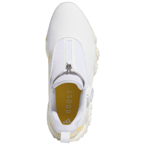 A white athletic shoe features a zippered top and a cushioned yellow insole labeled BOOST with textured patterns on the upper and a thick sole designed for comfort and support.