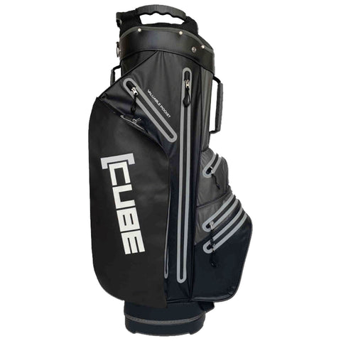 A black golf bag stands upright featuring multiple zipped pockets and a prominent white logo labeled CUBE on the side designed for carrying golf clubs and accessories.