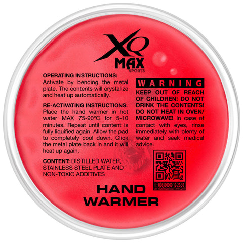 A round, red hand warmer includes activation instructions and warnings printed on its surface. The object is designed to heat up automatically when a metal plate inside is bent.