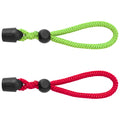 Two looped straps made of braided cord hang vertically the top strap is green and the bottom strap is red each has a black adjustable stop near the beginning of the loop