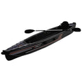 A black kayak with a sleek design rests horizontally with an oar resting across it featuring the text XPRO 4.7 on the side suggesting a water-based activity in an outdoor setting.