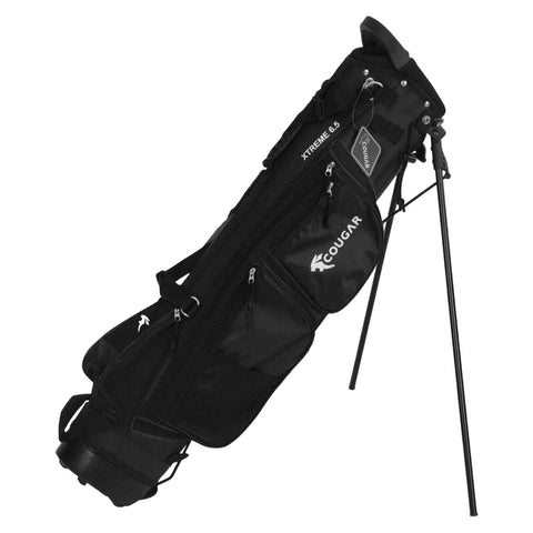 A black golf bag stands upright on a support leg featuring several zippered pockets for storage branded with the name Cougar and model Xtreme 6.5 in a functional design.