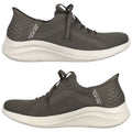 A pair of athletic shoes in dark green with a breathable mesh upper are positioned side by side showcasing their sleek design and cushioned soles in a neutral background.