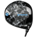 A golf driver with a sleek black head featuring a textured design is positioned prominently. It is designed for high performance with branding and model details clearly displayed.