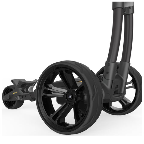 A black stroller with large, stylish wheels rests on a white surface while the wheels appear to be in a stationary position showcasing their sleek design and robust build.