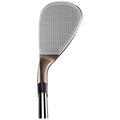 A golf club head with a metallic finish rests upright displaying a textured face designed for striking the ball emphasizing its sleek design without any surrounding context or environment.