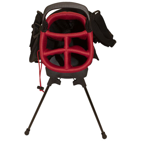 A backpack-style chair with a red mesh interior is displayed upright on three black legs suggesting it is designed for portability and convenience in outdoor settings.