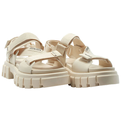 Beige sandals feature a thick platform sole and several adjustable straps made of fabric showing a modern and stylish design suitable for casual or outdoor wear.