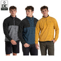 Three young men model different colored quarter-zip fleece tops including gray blue and yellow each stands in a relaxed pose against a plain white background with casual shorts or pants.