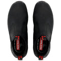 Black slip-on shoes are displayed from above showcasing a smooth exterior and elastic sides for easy wear with bold red branding visible inside the shoe indicating the brand name Hard Yakka.