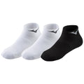 Three pairs of ankle socks are arranged together featuring two white socks and one black sock each adorned with a logo the background is plain and neutral.