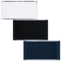 Three bath mats displayed side by side feature a white mat at the top a black mat in the center and a dark blue mat at the bottom all in rectangular shapes with textured surfaces.