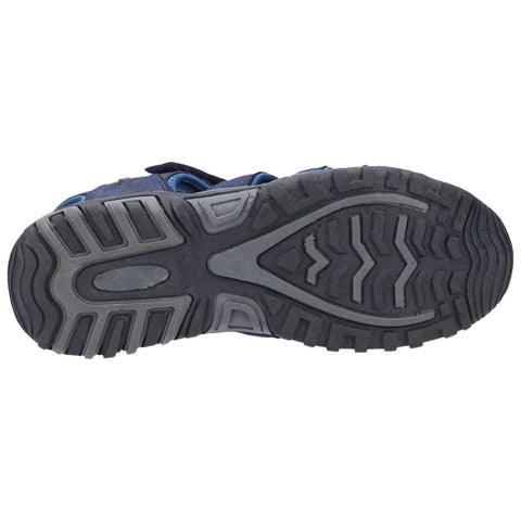 A black and grey shoe sole is displayed with a tread pattern showing wear and grip. The context suggests its use for outdoor activities or hiking on various terrains.