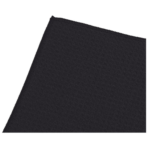 A black textured fabric is shown partially folded at an edge with visible stitching details creating a clean finish in a neutral background emphasizing its color and texture.