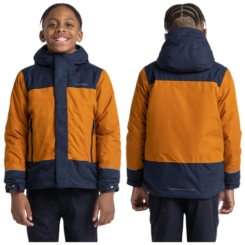 A smiling child wearing a two-toned orange and navy jacket stands in a neutral background with arms relaxed by the sides showcasing both front and back views of the jacket.