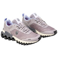 A pair of gray athletic shoes with mesh material and a distinctive sole featuring circular cutouts sits on a white background designed for style and comfort