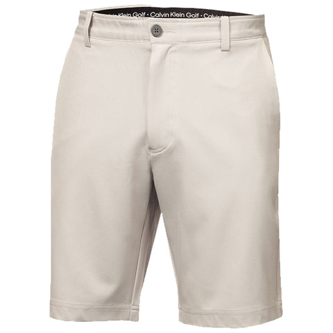 Beige shorts are displayed with a focus on the back view showing a flat waistband and two welt pockets emphasizing a casual summer style in a neutral color.