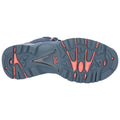 A gray athletic shoe sole features a textured pattern with prominent orange accents. It is positioned against a plain white background showcasing its design and tread for traction on various surfaces.