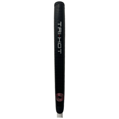 A black golf putter grip is prominently displayed featuring a textured surface for better handling with the label TRI-HOT printed in white and a circular design at the bottom.