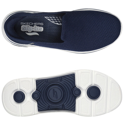 Navy slip-on sneakers featuring a breathable mesh upper and a white rubber sole with textured grip patterns are displayed from above and below against a plain background. Text reads SKECHERS Slip-ins.