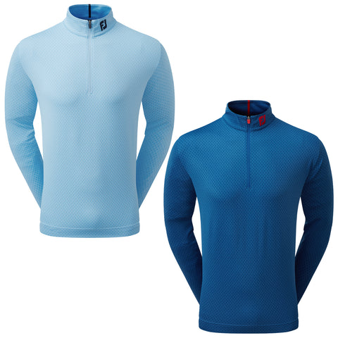 Two long-sleeved shirts are displayed side by side one is light blue with a half-zip collar and the other is dark blue also featuring a half-zip collar both have a textured pattern