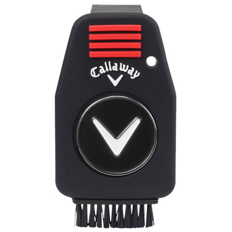 A black golf tee cleaner features a central circular brush head with short bristles underneath and a prominent Callaway logo on the front surrounded by red and white accents.