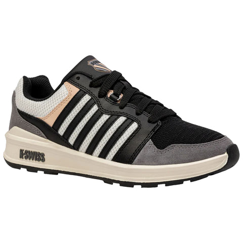 A black and gray athletic shoe features a textured surface with multiple stripes and a logo on the tongue providing a modern design suitable for casual or sports activities.