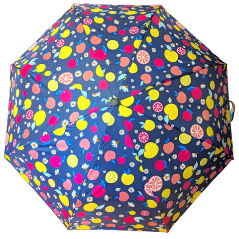 A multi-colored umbrella displays various fruit patterns against a dark blue background while being ready for use in a rainy or sunny environment.