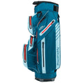 A blue and white golf bag stands upright featuring multiple zippered pockets and a prominent brand name. It is designed for carrying golf clubs and accessories.