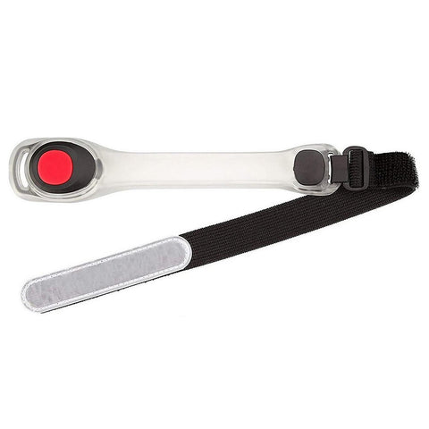 A clear plastic wristband with a large red button and a black button is attached to a black adjustable strap providing a secure fit for use on a wrist or arm.