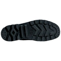 A black shoe sole is positioned flat with a rugged tread pattern showcasing grooves and indentations designed for traction in various environments such as outdoor terrains or urban settings