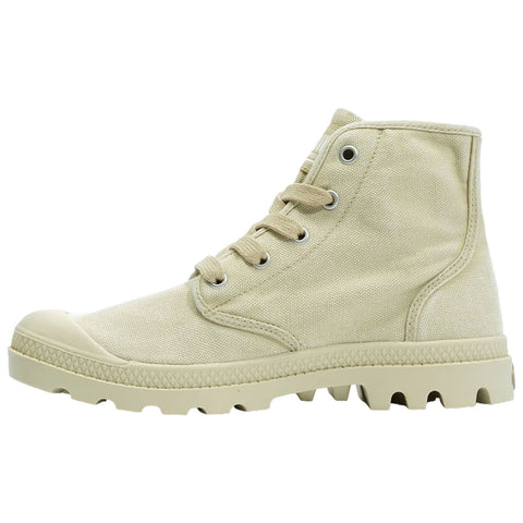 A cream canvas high-top sneaker stands upright showcasing its laces and textured sole designed for traction in outdoor environments highlighting a functional and stylish footwear choice.