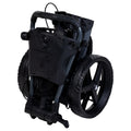 A compact black wheelchair is folded and positioned upright showcasing its sturdy wheels and handlebars while the overall design emphasizes mobility and ease of transport.