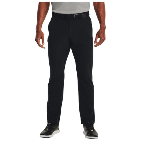 Black pants are worn by a person standing upright with both hands relaxed at their sides in a neutral environment likely featuring a plain background