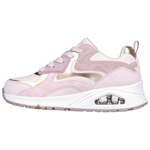 A pink sneaker with a rounded toe features metallic gold accents and a visible air cushioning unit on the sole designed for comfort and style in sports or casual wear.