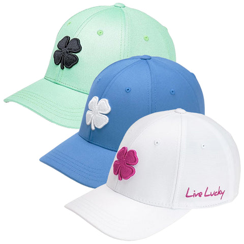 Three colorful baseball caps are displayed side by side featuring a four-leaf clover logo each in different colors green blue and white with the text Live Lucky on the white cap