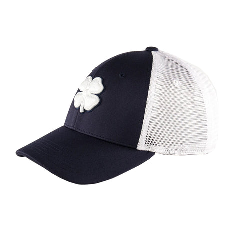 A navy baseball cap features a white four-leaf clover emblem on the front and a white mesh back, designed for casual wear in outdoor settings.