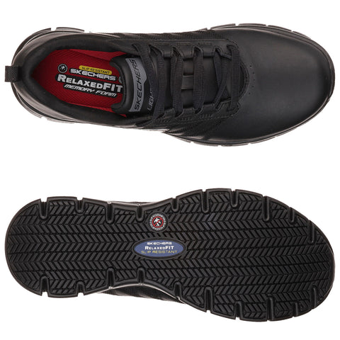 A black athletic shoe sits upright showcasing its sleek design and textured sole. The laces are threaded through eyelets, revealing a cushioned interior labeled with brand and slip-resistant features.