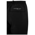 Black athletic shorts are displayed hanging vertically with an elastic waistband and a label on the back featuring the word PROQUIP in white stitching against the fabric.