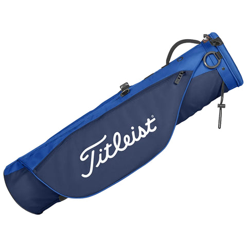 A blue golf bag is angled with a zipper and a handle visible featuring the Titleist logo prominently displayed on the side indicating it is designed for carrying golf clubs on the course.